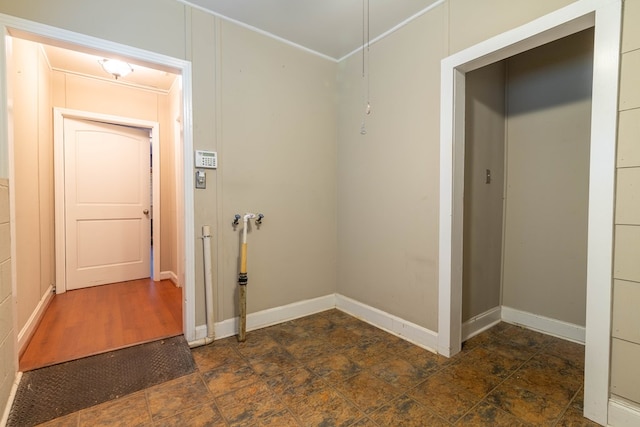 interior space featuring stone finish flooring and baseboards