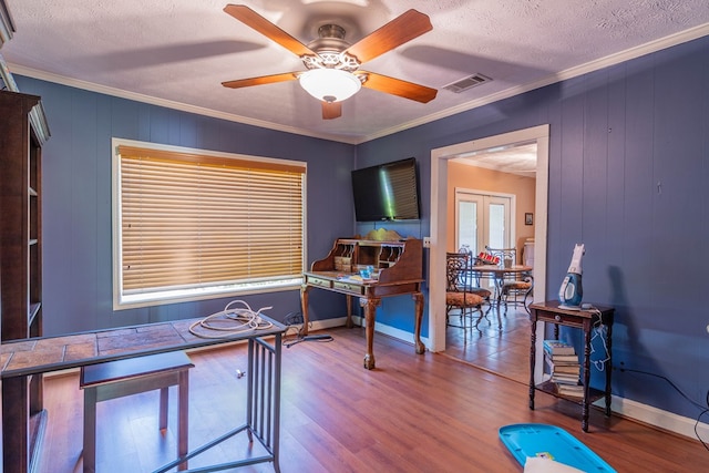 office area featuring ornamental molding, a textured ceiling, and wood finished floors