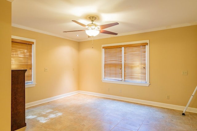 empty room with ceiling fan, baseboards, and ornamental molding