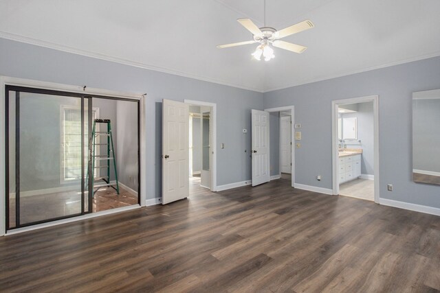 unfurnished bedroom with ensuite bathroom, ceiling fan, ornamental molding, and dark wood-type flooring