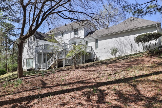 view of side of property with a deck