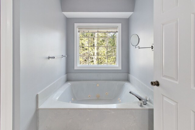 bathroom with tiled bath