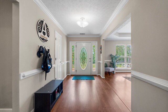 485 Boyd Branch Dr, Upatoi, GA 31829 - entrance foyer with wood finished floors, ornamental molding, baseboards, and a textured ceiling