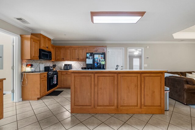 485 Boyd Branch Dr, Upatoi, GA 31829 - kitchen with black appliances, open floor plan, light tile patterned floors, backsplash, and crown molding