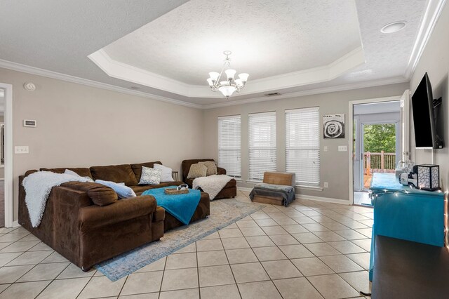 485 Boyd Branch Dr, Upatoi, GA 31829 - living area featuring a tray ceiling, light tile patterned floors, ornamental molding, a textured ceiling, and a chandelier