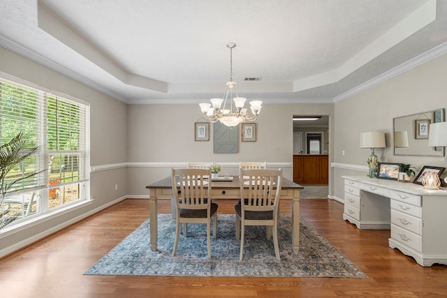 485 Boyd Branch Dr, Upatoi, GA 31829 - dining area featuring a tray ceiling, a chandelier, wood finished floors, baseboards, and ornamental molding
