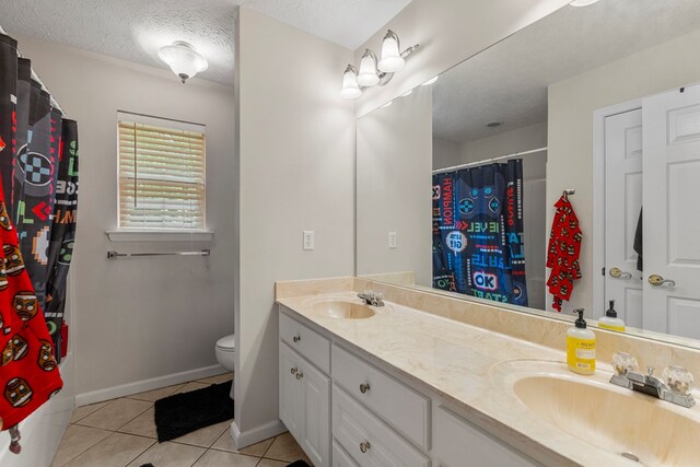 485 Boyd Branch Dr, Upatoi, GA 31829 - bathroom with double vanity, tile patterned flooring, toilet, baseboards, and a shower with curtain
