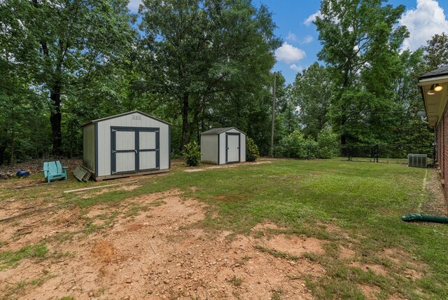485 Boyd Branch Dr, Upatoi, GA 31829 - view of yard with central AC unit and view of wooded area