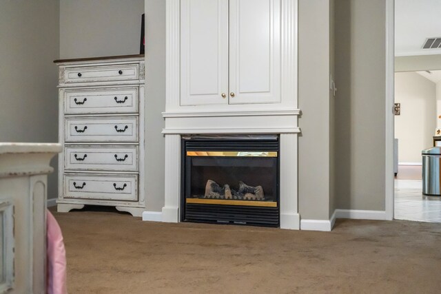 485 Boyd Branch Dr, Upatoi, GA 31829 - detailed view of carpet, baseboards, and a glass covered fireplace