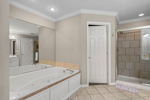 485 Boyd Branch Dr, Upatoi, GA 31829 - bathroom featuring a stall shower, a tub with jets, a textured ceiling, tile patterned flooring, and vanity