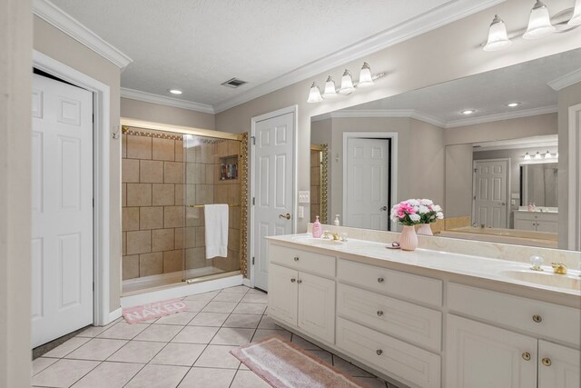 485 Boyd Branch Dr, Upatoi, GA 31829 - bathroom featuring double vanity, a stall shower, tile patterned flooring, crown molding, and recessed lighting