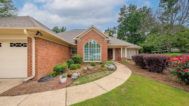 6537 Georgian Way, Columbus, GA 31909 - view of front of home with brick siding, a chimney, a garage, and a shingled roof