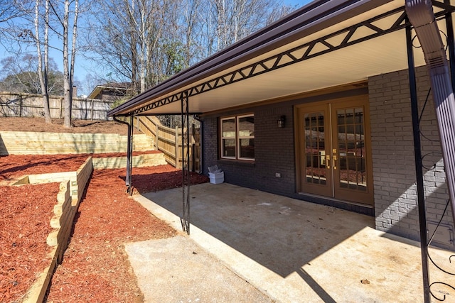 view of patio / terrace with fence and french doors