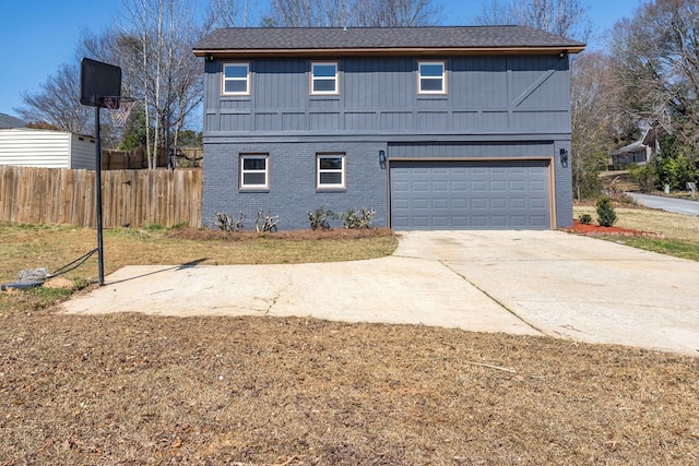 view of front of home featuring a garage, brick siding, driveway, and fence