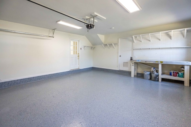 garage featuring baseboards and a garage door opener