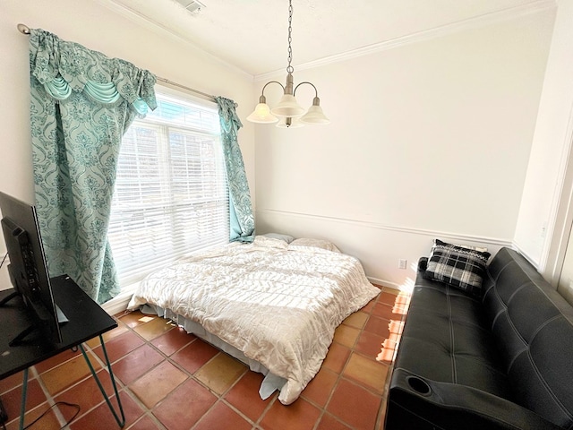 bedroom featuring a chandelier, dark tile patterned floors, and crown molding