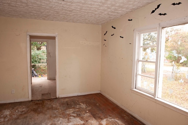 spare room featuring a textured ceiling