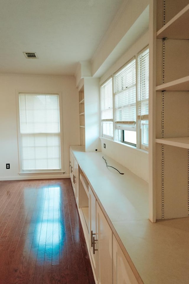 kitchen with dark hardwood / wood-style flooring