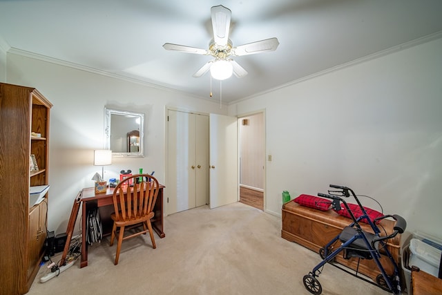 office with crown molding, light carpet, and ceiling fan