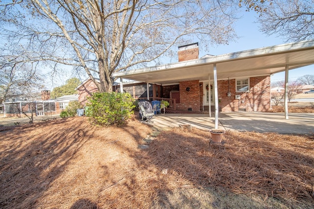 exterior space featuring a carport