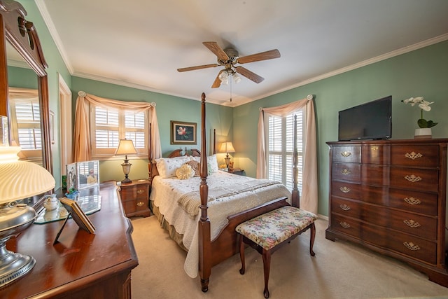 carpeted bedroom with multiple windows, ornamental molding, and ceiling fan