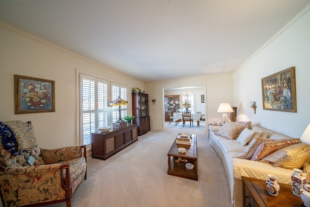 living room featuring ornamental molding, light carpet, and a notable chandelier