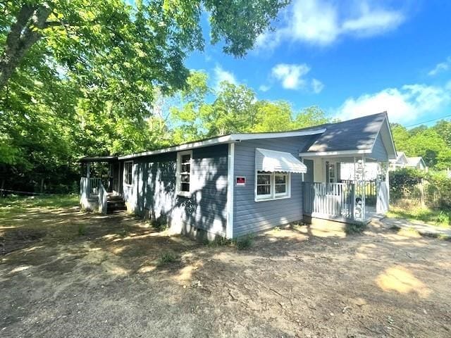 view of property exterior with covered porch