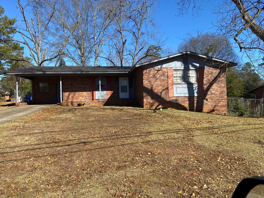 view of front of property with a carport