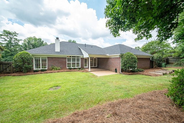 4548 Carnoustie Ln, Columbus, GA 31909 - rear view of property with brick siding, a patio area, a chimney, and a shingled roof