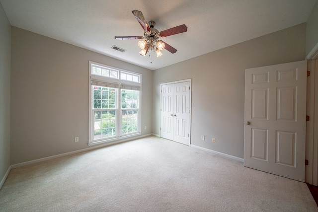 4548 Carnoustie Ln, Columbus, GA 31909 - unfurnished bedroom featuring carpet, a closet, and a ceiling fan