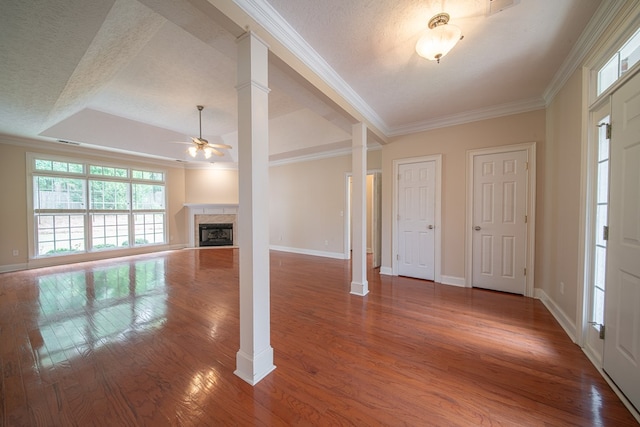 4548 Carnoustie Ln, Columbus, GA 31909 - entrance foyer featuring ceiling fan, a fireplace, wood finished floors, ornamental molding, and ornate columns