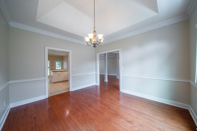 4548 Carnoustie Ln, Columbus, GA 31909 - unfurnished room with a chandelier, light wood-style flooring, and crown molding