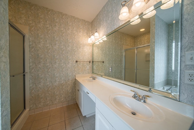 4548 Carnoustie Ln, Columbus, GA 31909 - full bath with tile patterned flooring, a shower with shower door, double vanity, and wallpapered walls