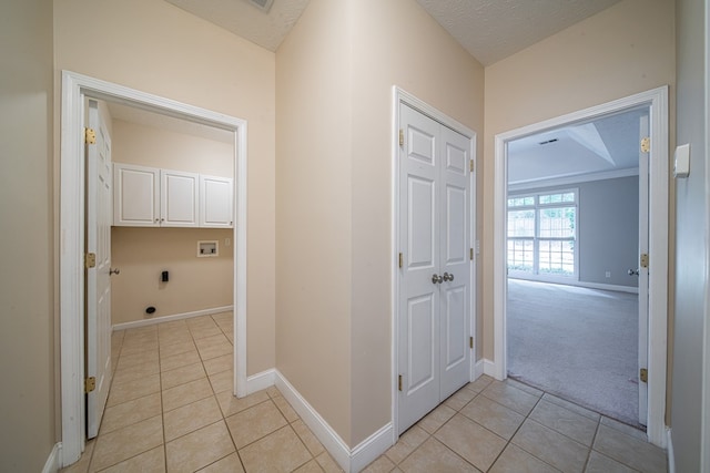 4548 Carnoustie Ln, Columbus, GA 31909 - washroom featuring hookup for a washing machine, electric dryer hookup, cabinet space, light tile patterned flooring, and a textured ceiling