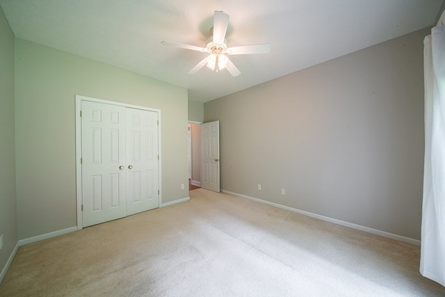 4548 Carnoustie Ln, Columbus, GA 31909 - unfurnished bedroom with light colored carpet, a closet, and a ceiling fan