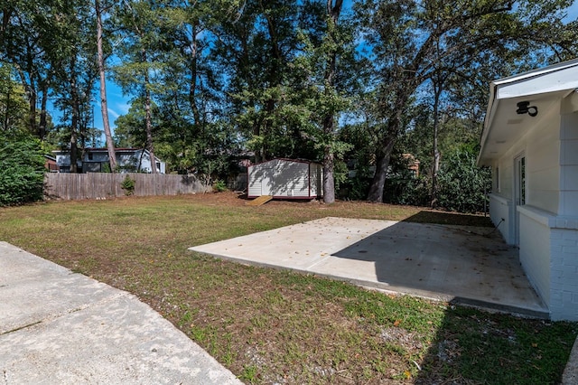 3409 Primrose Rd, Columbus, GA 31907 - view of yard with a storage shed and a patio area