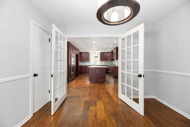 3409 Primrose Rd, Columbus, GA 31907 - kitchen featuring french doors, a center island, dark wood-style floors, light countertops, and recessed lighting