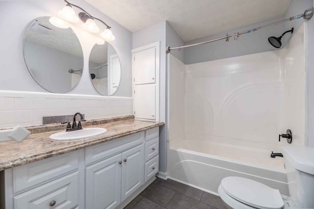 3409 Primrose Rd, Columbus, GA 31907 - full bathroom featuring vanity, tub / shower combination, tile patterned floors, and a textured ceiling