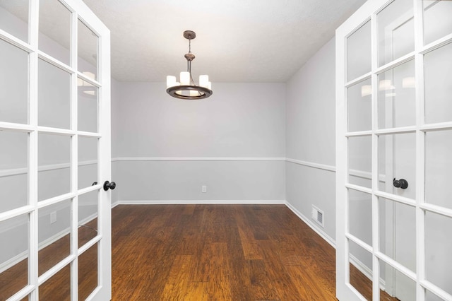 3409 Primrose Rd, Columbus, GA 31907 - empty room featuring a chandelier, wood finished floors, and french doors