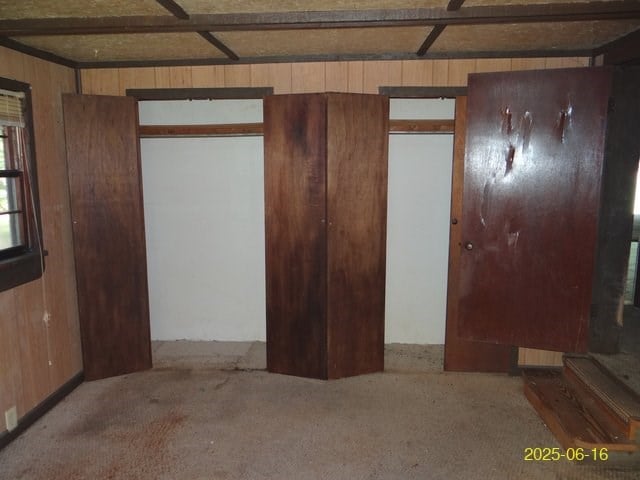 66 Glennhaven Rd, Phenix City, AL 36869 - unfurnished bedroom featuring wood walls