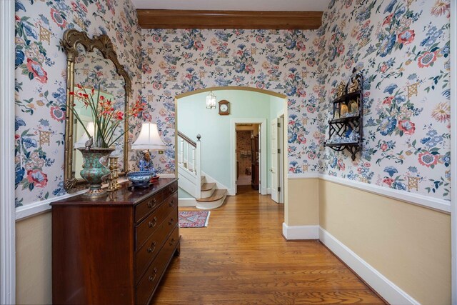 1400 Eberhart Ave, Columbus, GA 31906 - hall featuring light wood-style flooring, wallpapered walls, arched walkways, stairs, and baseboards