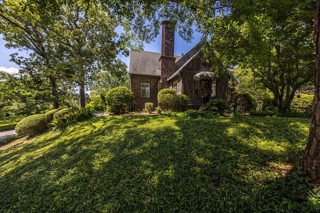 1400 Eberhart Ave, Columbus, GA 31906 - view of front facade with brick siding, a front yard, and a chimney