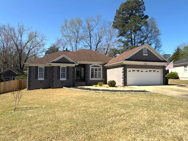 view of front facade with a front lawn, concrete driveway, fence, a garage, and stucco siding