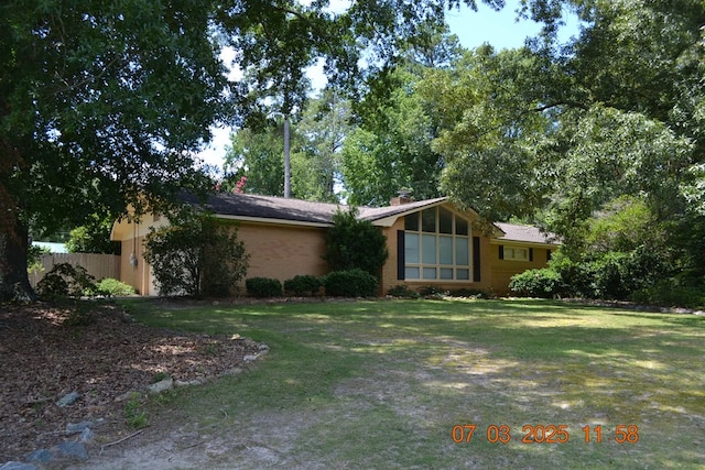 13642 Macon Rd, Upatoi, GA 31829 - view of front of house featuring a garage, brick siding, and a chimney