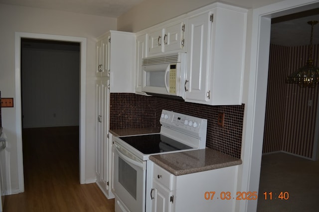 13642 Macon Rd, Upatoi, GA 31829 - kitchen with white appliances, decorative backsplash, wood finished floors, and white cabinets