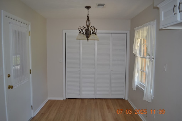 13642 Macon Rd, Upatoi, GA 31829 - unfurnished dining area featuring a chandelier and wood finished floors