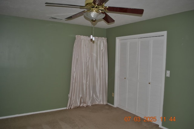 13642 Macon Rd, Upatoi, GA 31829 - unfurnished bedroom with carpet floors, a closet, and ceiling fan