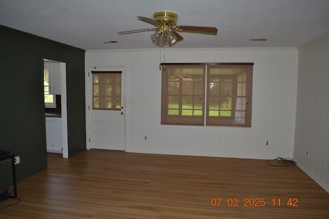 13642 Macon Rd, Upatoi, GA 31829 - spare room featuring wood finished floors, crown molding, and a ceiling fan