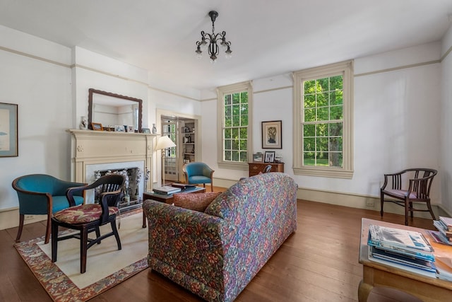 171 Jefferson Ave, Talbotton, GA 31827 - living area featuring wood-type flooring, a chandelier, and a fireplace