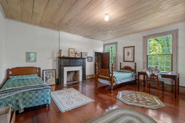 171 Jefferson Ave, Talbotton, GA 31827 - bedroom featuring wood-type flooring, wood ceiling, and a fireplace